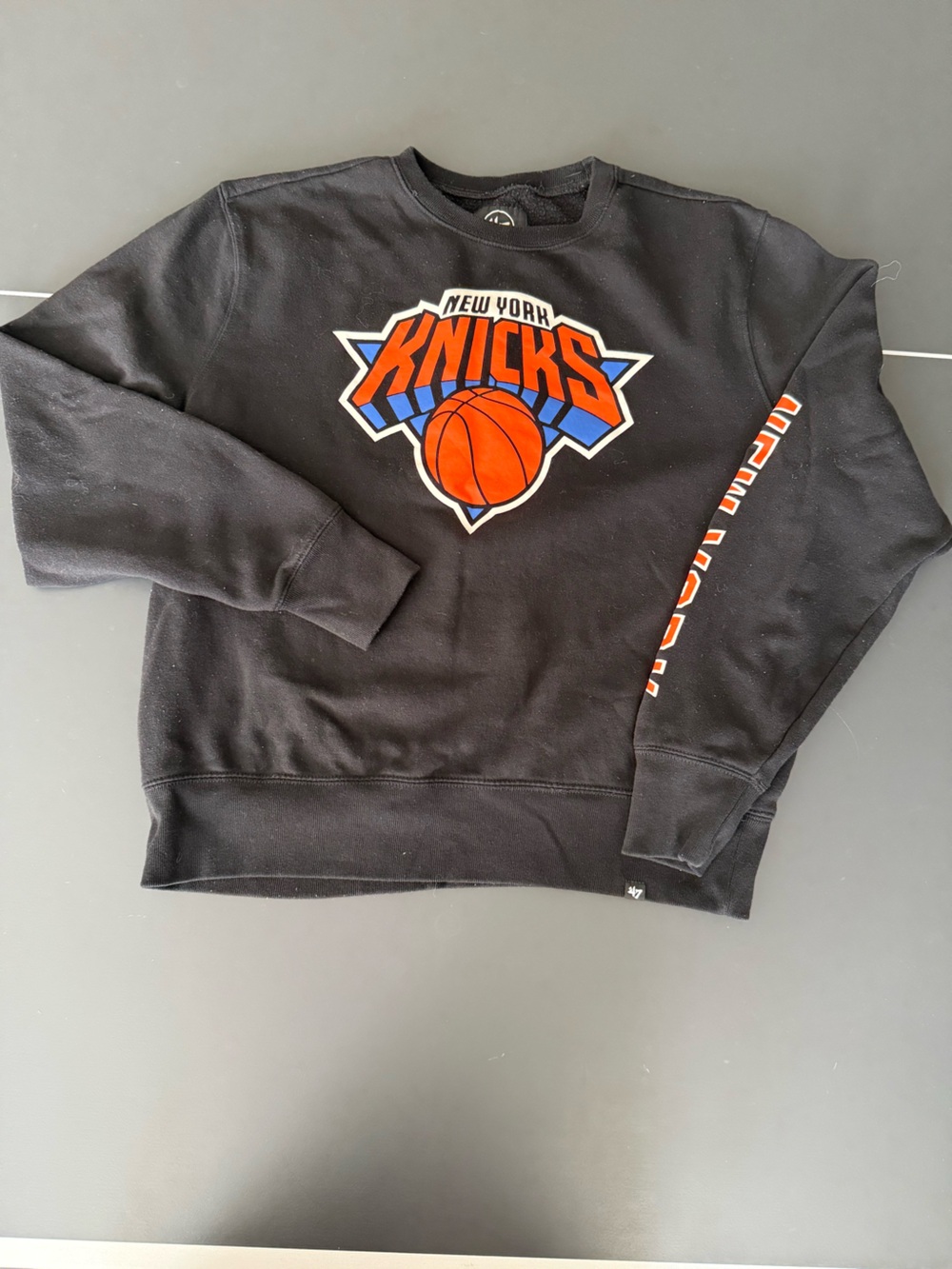 47 Kids Black Sweatshirt with Orange & Blue Knicks Logo